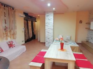 a living room with a white couch and a table at Sole&Mare in Monopoli