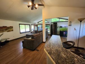 a living room with a couch and a table at little cozy house in a village in Mountain Dale