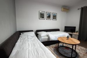 Postel nebo postele na pokoji v ubytování Paro's Daily Apartment