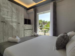 Ένα ή περισσότερα κρεβάτια σε δωμάτιο στο Vila Roxhest