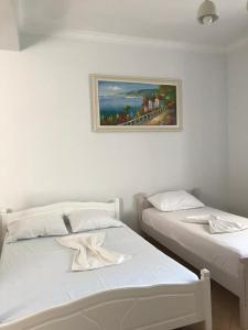 Postel nebo postele na pokoji v ubytování Alpha Apartaments