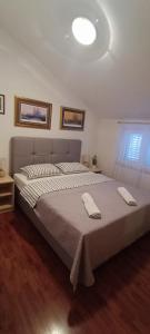 Postel nebo postele na pokoji v ubytování Apartman Beus
