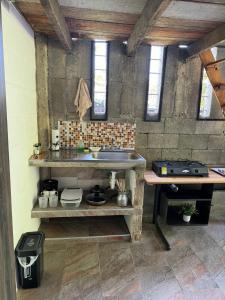 a kitchen with a counter and a sink in a room at Villa Isa in Cali