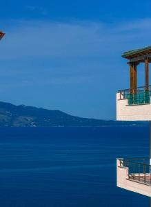 a view of a large body of blue water at Elysian Escape Apartment in Sarandë