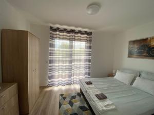 Posteľ alebo postele v izbe v ubytovaní Harley Apartman