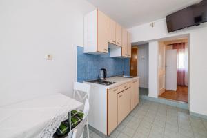 Kuchyň nebo kuchyňský kout v ubytování Apartments Ivan + 37 fotografií