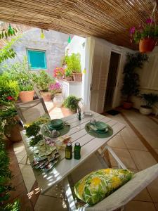 a white table and chairs on a patio at Casa Pamela in Capri