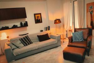 a living room with a couch and a chair at Lavandi 1 in Thessaloniki
