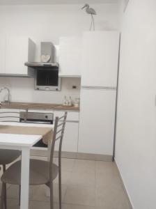 Kuchyň nebo kuchyňský kout v ubytování Le Sirene Sweet Home