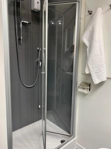 a shower with a glass door in a bathroom at Villa Pini in Civitanova Marche +38 photos