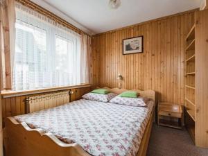 Łóżko lub łóżka w pokoju w obiekcie Dom Lesnik