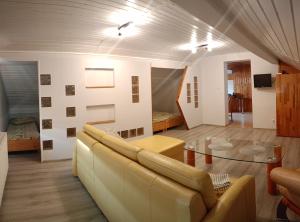 a living room with a couch and a table at Darłowska 49A in Dąbki