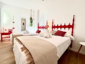 Playa de GandiaにあるCasa Luaの部屋に3つのベッドがあるグループ
