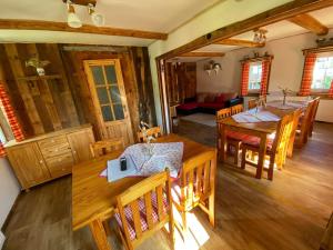 an overhead view of a dining room with tables and chairs at Apartmány u Dostálů in Bedřichov