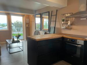 a kitchen with a wooden counter top in a room at FIVE Apartments - Boutique in Tromsø +7 photos
