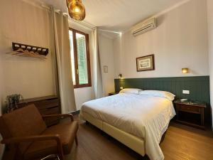 A bed or beds in a room at Affittacamere Zanobi 45