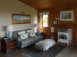 Posezení v ubytování Spacious cottage with sauna looking out on astonishing grasslands