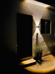 a door to a building with a light in the dark at Escape Romántico en Tepoztlán, Habitación Privada y Céntrica in Tepoztlán