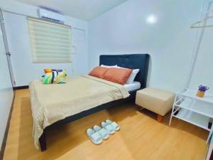 Ένα ή περισσότερα κρεβάτια σε δωμάτιο στο Condo in Marilao House Of Katrice