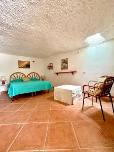 En eller flere senge i et værelse på Il Grottino By Gargà Residency