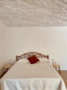 سرير أو أسرّة في غرفة في Vimini By Gargà Residency