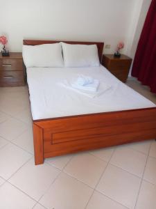 Postel nebo postele na pokoji v ubytování Hotel Taverna Prifti