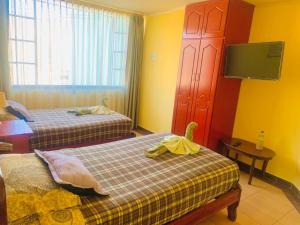 Letto o letti in una camera di Dos Hemisferios