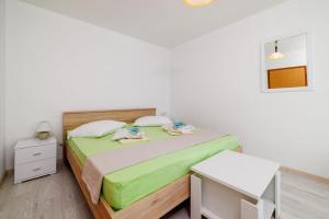 Postel nebo postele na pokoji v ubytování Apartments Ivan