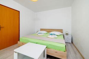 Postel nebo postele na pokoji v ubytování Apartments Ivan