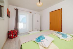 Postel nebo postele na pokoji v ubytování Apartments Ivan