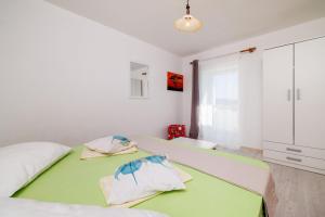 Postel nebo postele na pokoji v ubytování Apartments Ivan