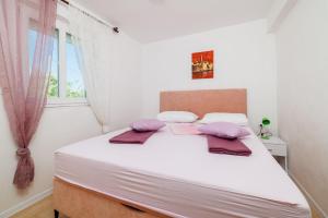 Postel nebo postele na pokoji v ubytování Apartments Ivan