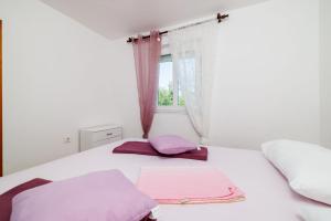 Postel nebo postele na pokoji v ubytování Apartments Ivan