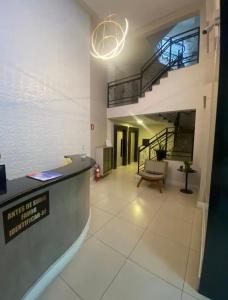 Khu vực ghế ngồi tại Apartamento Grande no Centro de São Lourenço-MG