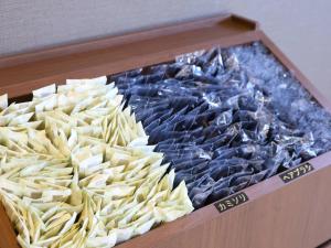 a box of food with pasta in it at Dormy Inn Express Mikawaanjo in Anjomachi