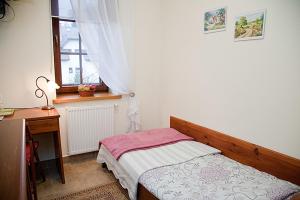 Posteľ alebo postele v izbe v ubytovaní Willa Cyprysowa