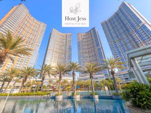 a collage of high rise buildings and palm trees at Gold Coast PIK Apartments by Host Jess in Jakarta