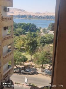 a view from a building with a view of a lake at شقة مفروشة رائعة كورنيش النيل برج الرياض in Naj‘ al ‘Amrāb +3 photos