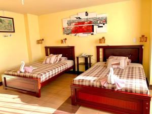 Letto o letti in una camera di Dos Hemisferios