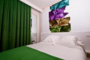 Postel nebo postele na pokoji v ubytování Hotel Lino