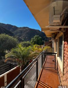 a balcony of a building with a view of a mountain at Apart Hotel Chilecito in Chilecito