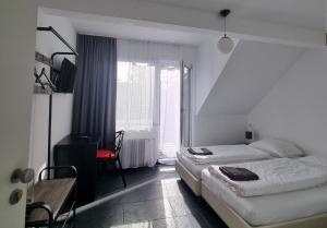 Postel nebo postele na pokoji v ubytování Am Basler Tor