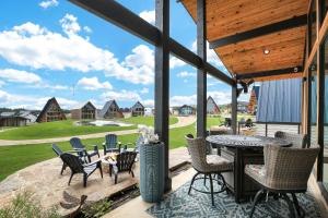 a patio with chairs and a table with a view at Private, Waterfront Escape in New Braunfels +31 photos