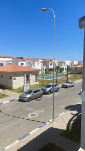 a group of cars parked in a parking lot at Location villa Golden Beach Casablanca in Casablanca