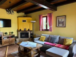 a living room with a couch and a tv at Secluded holiday house Glavnica Donja, Zagreb - 23154 in Belovar