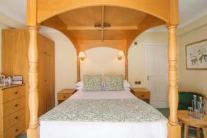 Säng eller sängar i ett rum på Moorhill House Bed & Breakfast