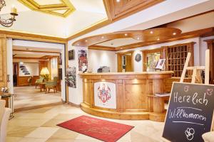 a restaurant with a counter in a room at Landhotel Voss im TalVital in Saalhausen +110 photos