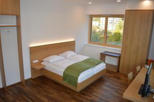 Posteľ alebo postele v izbe v ubytovaní Business Motel Feldkirch