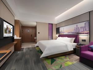 Letto o letti in una camera di Hampton by Hilton Guangzhou Wenchong