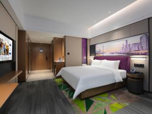 Letto o letti in una camera di Hampton by Hilton Guangzhou Wenchong